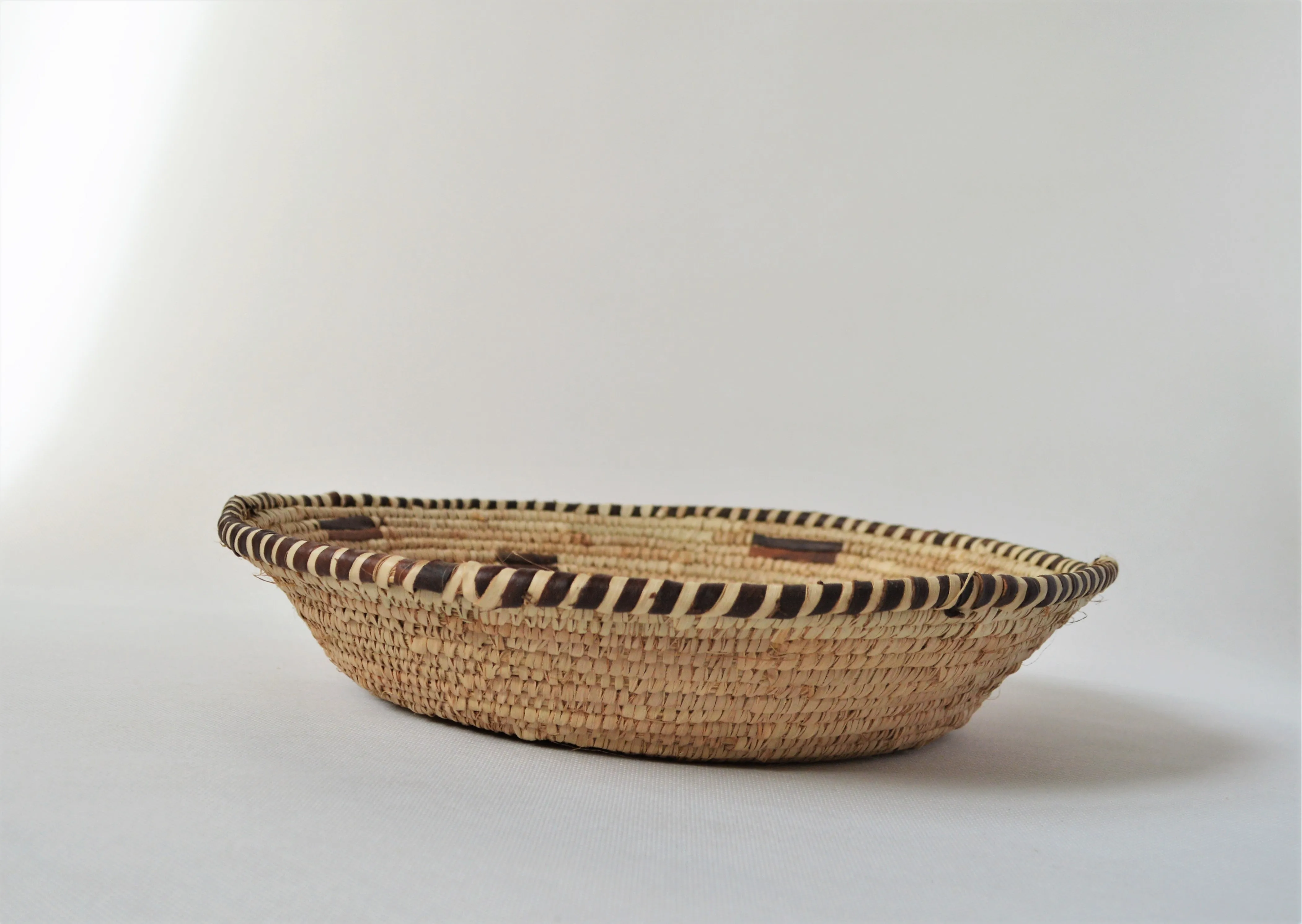 Woven straw and leather plate